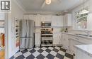 Kitchen featuring white cabinetry, stainless steel appliances, speckled countertops, and a white subway tile backsplash - 150 Union Boulevard, Kitchener, ON  - Indoor Photo Showing Kitchen With Double Sink 