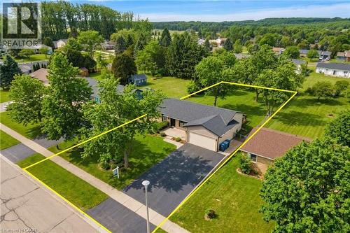 Single-story residence featuring a dark shingle roof and an attached two-car garage - 44 Mcclellan Road, Alton, ON - Outdoor With View