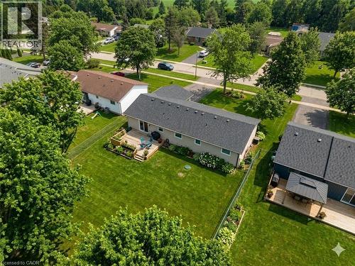 Expansive backyard featuring a manicured lawn, established perimeter fencing, and mature trees - 44 Mcclellan Road, Alton, ON - Outdoor