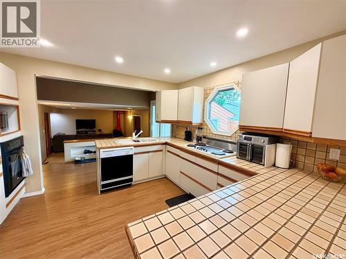 2173 Douglas Avenue, North Battleford, SK - Indoor Photo Showing Kitchen With Fireplace