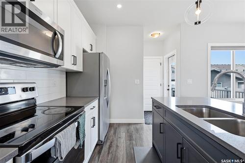 605 Feheregyhazi Boulevard, Saskatoon, SK - Indoor Photo Showing Kitchen With Double Sink