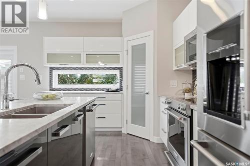 130 Boykowich Bend, Saskatoon, SK - Indoor Photo Showing Kitchen With Stainless Steel Kitchen With Double Sink With Upgraded Kitchen