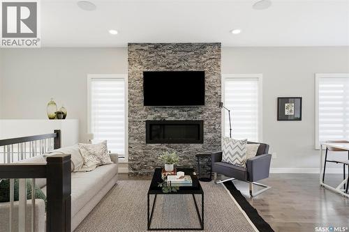130 Boykowich Bend, Saskatoon, SK - Indoor Photo Showing Living Room With Fireplace