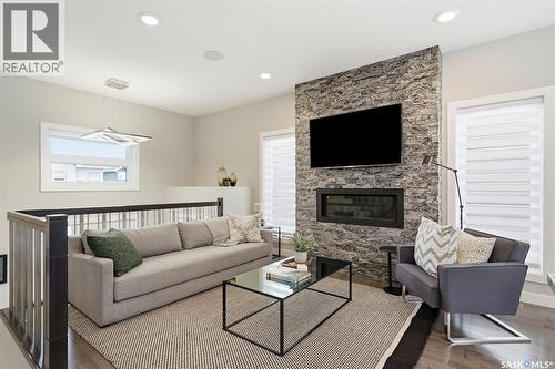 130 Boykowich Bend, Saskatoon, SK - Indoor Photo Showing Living Room With Fireplace