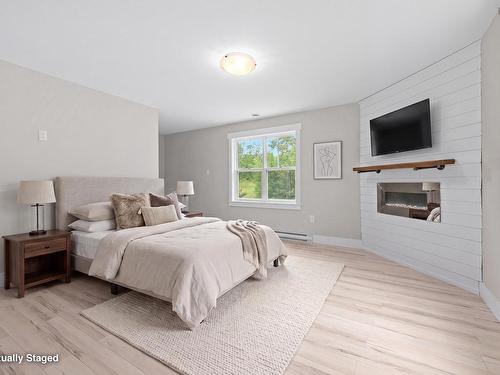 7 Copperhead Road, Fall River, NS - Indoor Photo Showing Bedroom With Fireplace