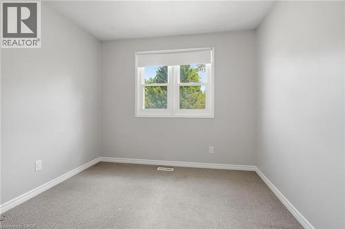Neutral gray walls complement the gray carpeting - 509 Quiet Place Unit# 1, Waterloo, ON - Indoor Photo Showing Other Room