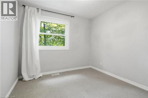 Bright room with light gray walls and plush gray carpeting - 509 Quiet Place Unit# 1, Waterloo, ON - Indoor Photo Showing Other Room