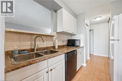 65 Silvercreek Parkway N Unit# 404, Guelph, ON - Indoor Photo Showing Kitchen With Double Sink