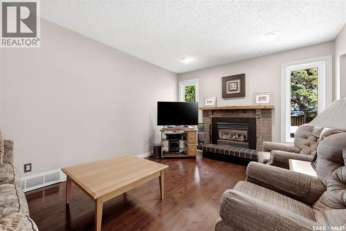2118 Elderkin Drive E, Regina, SK - Indoor Photo Showing Living Room With Fireplace