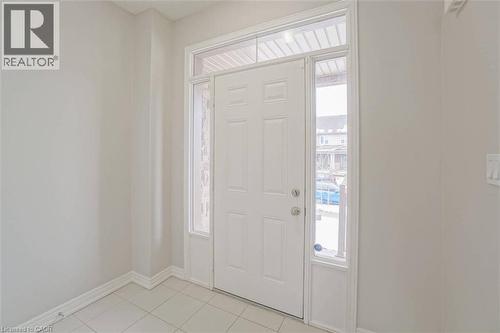 Entryway featuring a white paneled door, transom window, and sidelights - 70 Bradbury Road, Hamilton, ON - Indoor Photo Showing Other Room