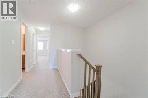Carpeted hallway with light-toned walls and built-in ceiling lighting - 70 Bradbury Road, Hamilton, ON - Indoor Photo Showing Other Room