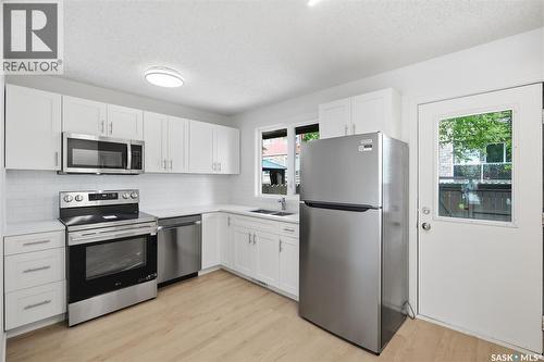 9 1128 Mckercher Drive, Saskatoon, SK - Indoor Photo Showing Kitchen With Double Sink