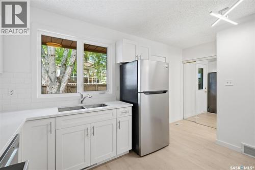 9 1128 Mckercher Drive, Saskatoon, SK - Indoor Photo Showing Kitchen With Double Sink