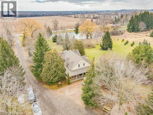 Charming farmhouse set on expansive grounds with mature evergreen and deciduous trees providing natural privacy - 875 Safari Road, Hamilton, ON 