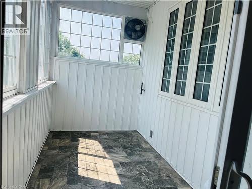 Room with paneled walls and dark-toned flooring - 83 Keewatin Avenue, Kitchener, ON -  With Exterior