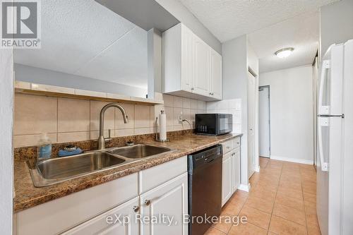 404 - 65 Silvercreek Parkway N, Guelph (Junction/Onward Willow), ON - Indoor Photo Showing Kitchen With Double Sink