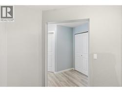 Looking out from the Den to the hallway and coat closet - 
