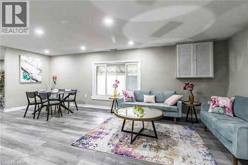 Recessed lighting, wood-finish flooring, sliding window, and built-in louvered cabinetry - 15 Spiers Crescent, Cambridge, ON - Indoor