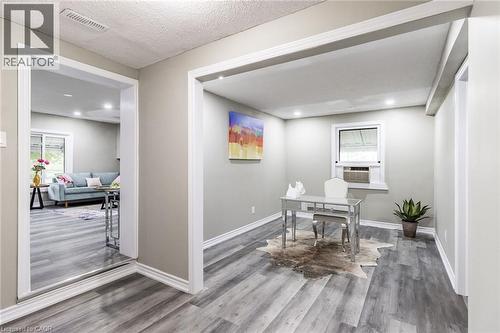 Recessed lighting, light gray walls, wood-finish flooring, white trim, and a window for natural light - 15 Spiers Crescent, Cambridge, ON - Indoor