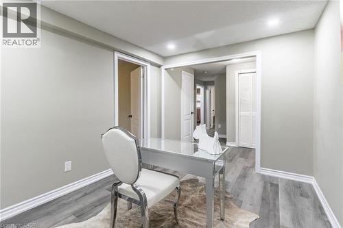 Recessed ceiling lighting, light gray wall paint, wood-finish flooring, white trim, and white louvered closet doors - 15 Spiers Crescent, Cambridge, ON - Indoor