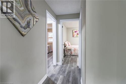 Hallway featuring wood-finish flooring, light-toned walls, and white trim - 15 Spiers Crescent, Cambridge, ON - Indoor Photo Showing Other Room