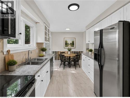 Virtually Staged. - 3401 Rockwood Drive, Burlington, ON - Indoor Photo Showing Kitchen With Double Sink