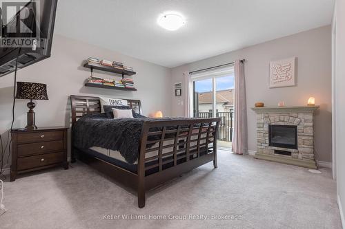 35 - 107 Westra Drive, Guelph (Willow West/Sugarbush/West Acres), ON - Indoor Photo Showing Bedroom With Fireplace