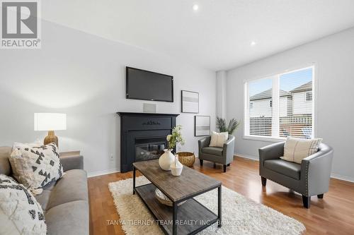 75 Robert Attersley Drive E, Whitby, ON - Indoor Photo Showing Living Room With Fireplace