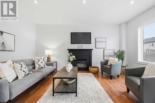75 Robert Attersley Drive E, Whitby, ON - Indoor Photo Showing Living Room With Fireplace