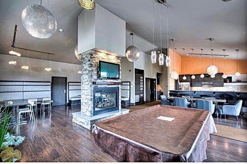 Salle communautaire - 204-5131 Av. Eliot, Laval (Chomedey), QC - Indoor With Fireplace