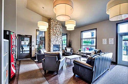 Salle communautaire - 204-5131 Av. Eliot, Laval (Chomedey), QC - Indoor With Fireplace