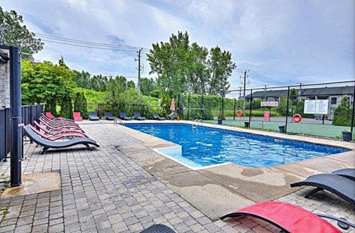 Piscine - 204-5131 Av. Eliot, Laval (Chomedey), QC - Outdoor With In Ground Pool