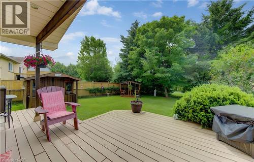Expansive backyard featuring a large composite deck and a detached shed - 599 Coldstream Drive, Waterloo, ON - Outdoor With Deck Patio Veranda