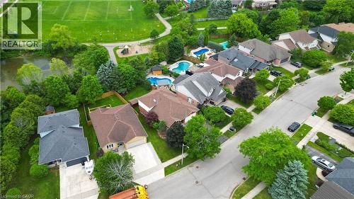Aerial perspective showcasing a residential street with multiple detached homes - 599 Coldstream Drive, Waterloo, ON - Outdoor With View