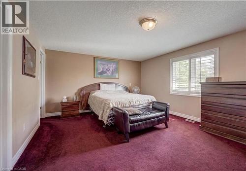 Spacious bedroom featuring deep pile carpeting and neutral tone walls - 599 Coldstream Drive, Waterloo, ON - Indoor Photo Showing Bedroom