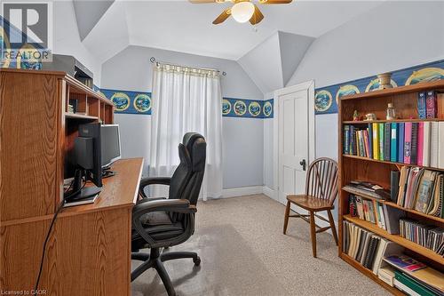 Neutral-toned carpeting, light blue walls, a ceiling fan with integrated lighting, and a window with sheer curtains - 230 Picton Street E, Hamilton, ON - Indoor Photo Showing Office