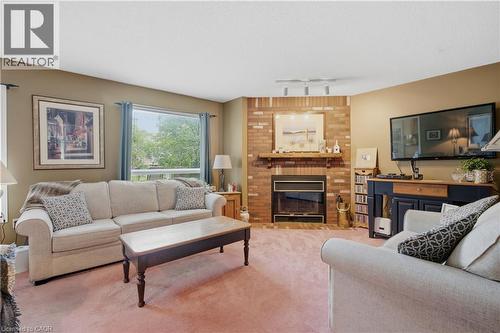 131 Huntingwood Avenue, Hamilton, ON - Indoor Photo Showing Living Room With Fireplace