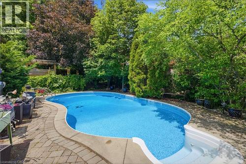 131 Huntingwood Avenue, Hamilton, ON - Outdoor With In Ground Pool With Backyard