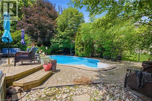 131 Huntingwood Avenue, Hamilton, ON - Outdoor With In Ground Pool