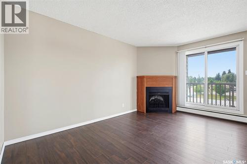 308 203 Tait Place, Saskatoon, SK - Indoor Photo Showing Living Room With Fireplace