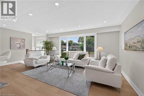 Wood-finish flooring with recessed lighting - 40 Purdy Crescent, Hamilton, ON - Indoor Photo Showing Living Room
