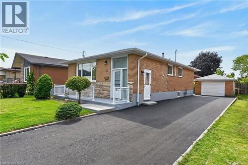 Brick exterior with stone accents and white railings - 40 Purdy Crescent, Hamilton, ON - Outdoor