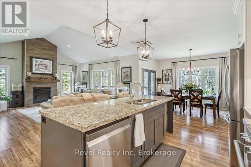 59 Trout Lane, Tiny, ON - Indoor Photo Showing Kitchen With Fireplace With Double Sink