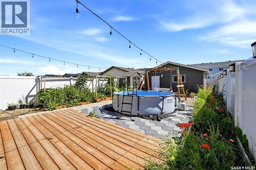 3409 Green Jade Lane, Regina, SK - Outdoor With Above Ground Pool With Deck Patio Veranda