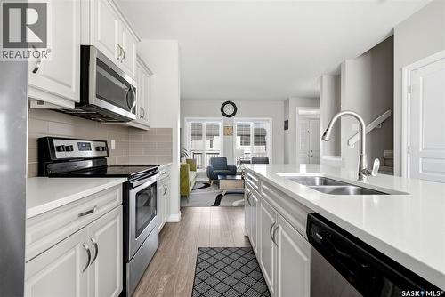 3409 Green Jade Lane, Regina, SK - Indoor Photo Showing Kitchen With Stainless Steel Kitchen With Double Sink With Upgraded Kitchen