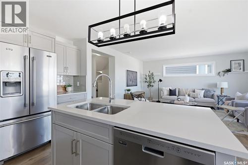 812 1St Avenue N, Warman, SK - Indoor Photo Showing Kitchen With Double Sink