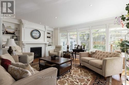Sun filled family room - 38 Yates Street, St. Catharines (Downtown), ON - Indoor Photo Showing Living Room With Fireplace