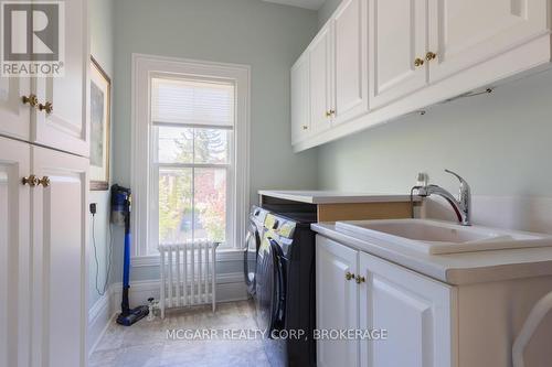 2nd floor laundry with sink + closets - 38 Yates Street, St. Catharines (Downtown), ON - Indoor Photo Showing Laundry Room
