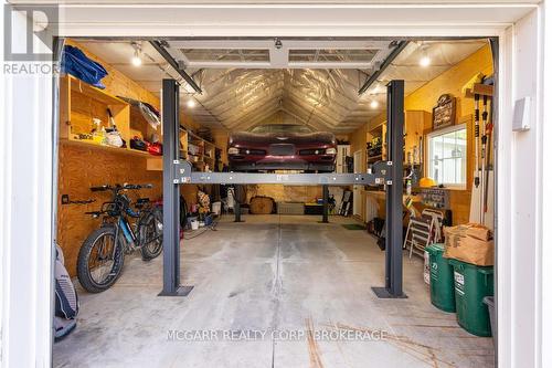 Lift allowing for two car garage - 38 Yates Street, St. Catharines (Downtown), ON - Indoor Photo Showing Garage