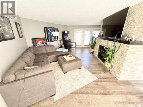 3 Mclelland Bay, Weyburn, SK - Indoor Photo Showing Living Room With Fireplace